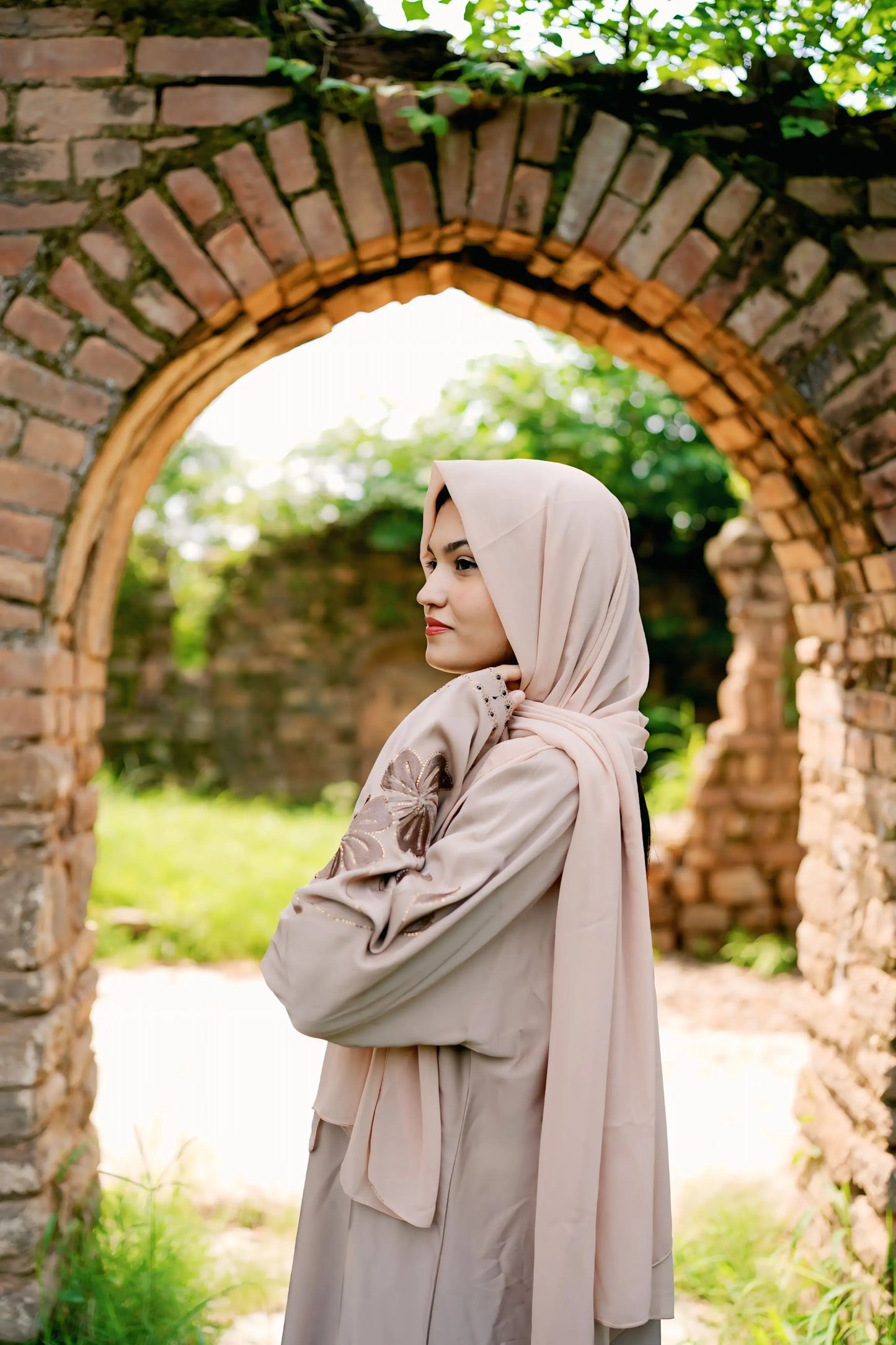 Girl in a modest abaya dress paired with a classic hijab for a timeless look.