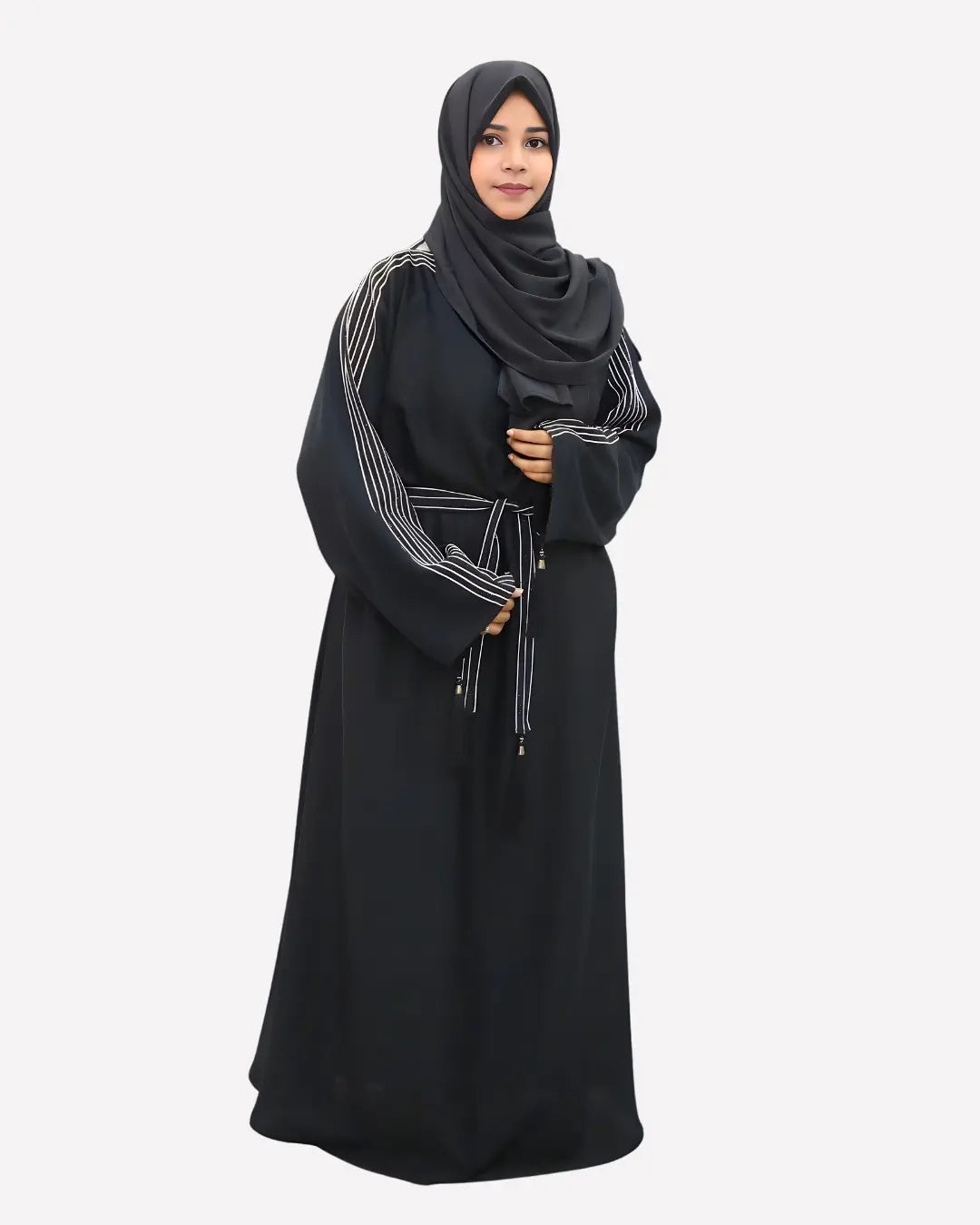 Woman wearing a black abaya with a matching hijab on a white background