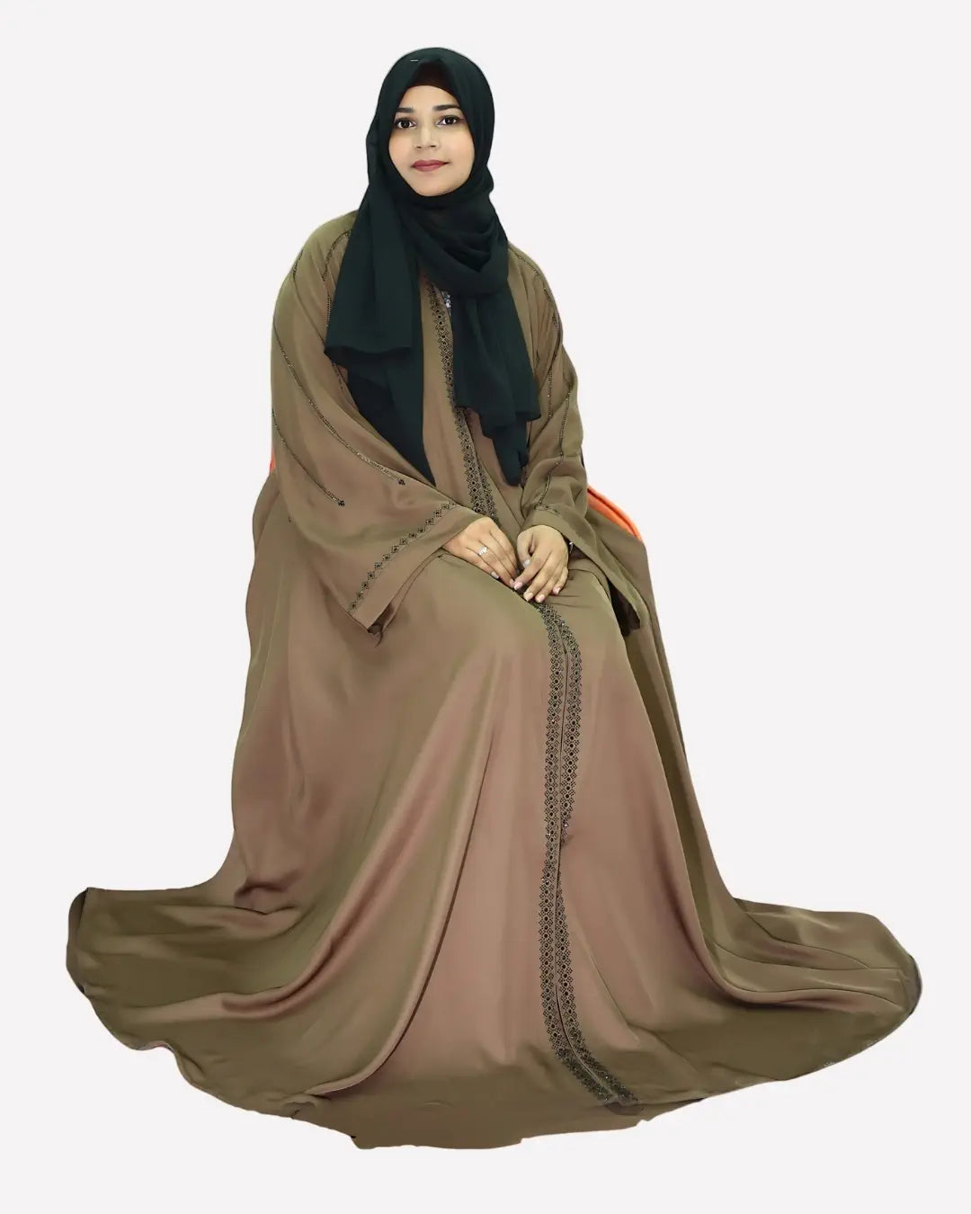 Woman wearing a premium abaya dress with a black hijab on a white background