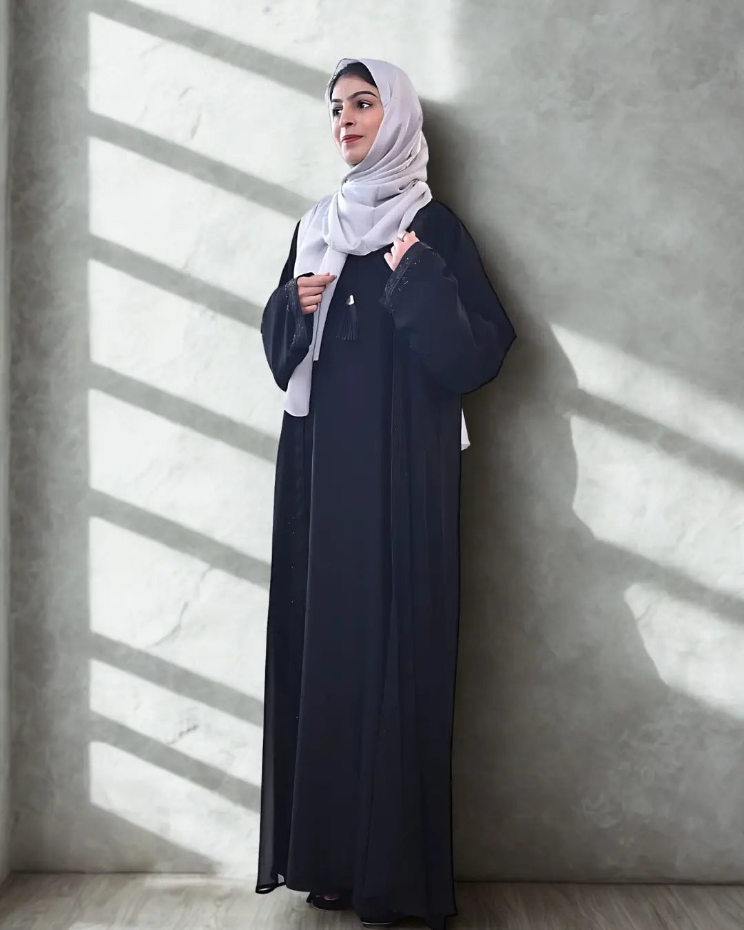 A girl wearing a premium quality abaya with black hijab