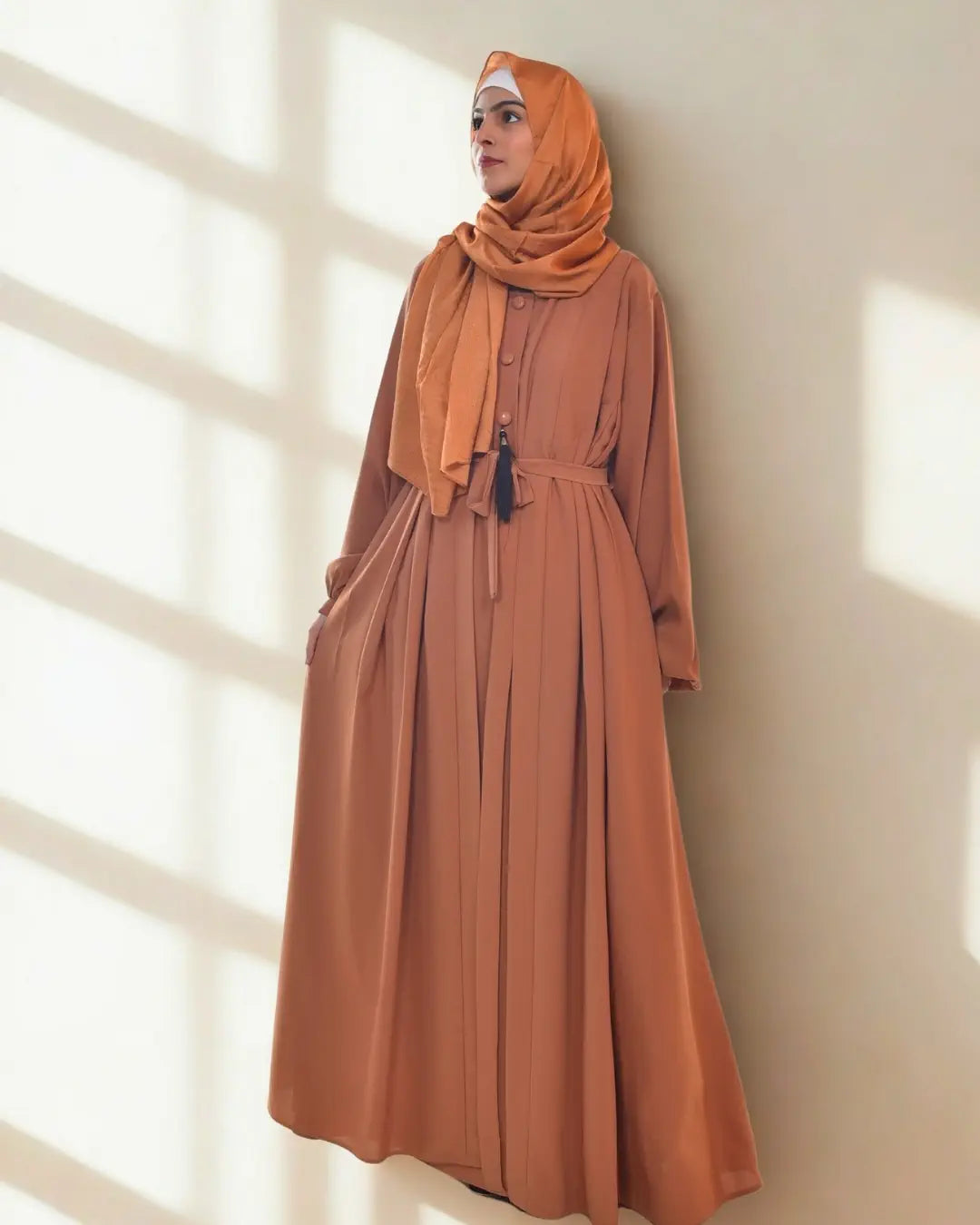 A girl wearing a premium quality abaya with hijab