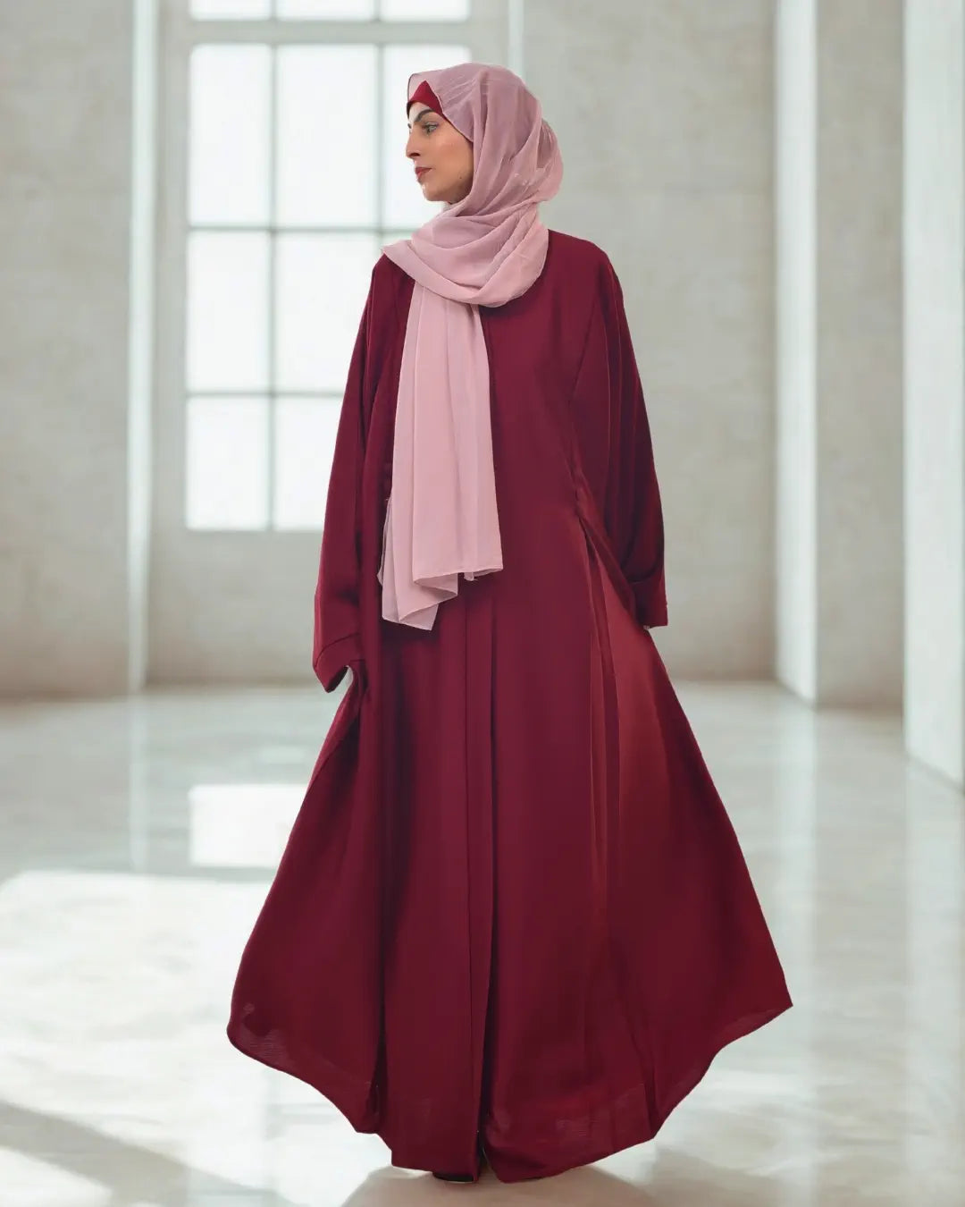 A girl wearing a premium quality abaya with black hijab