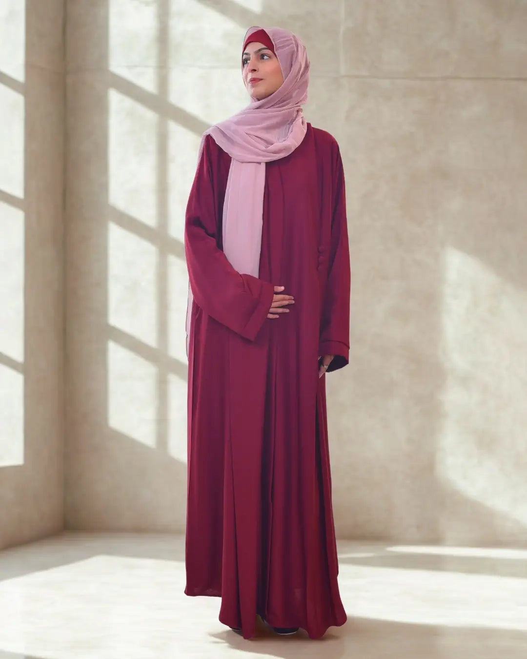 A girl wearing a premium quality abaya with black hijab