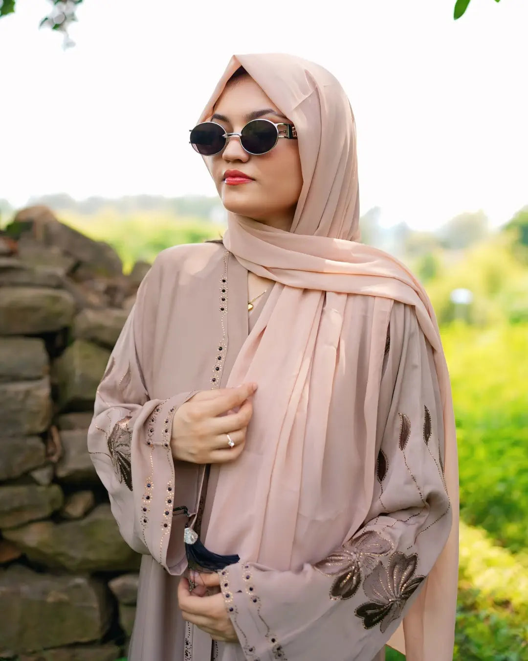 Girl is wearing premium quality abaya with matching hijab