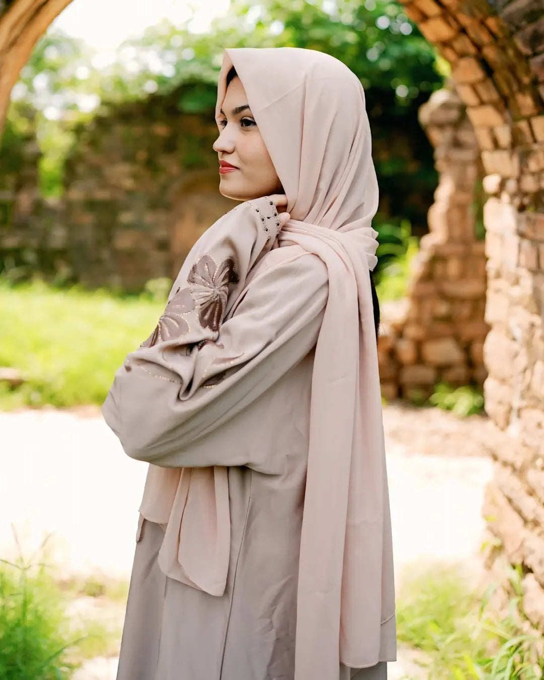 Girl is wearing premium quality abaya with matching hijab