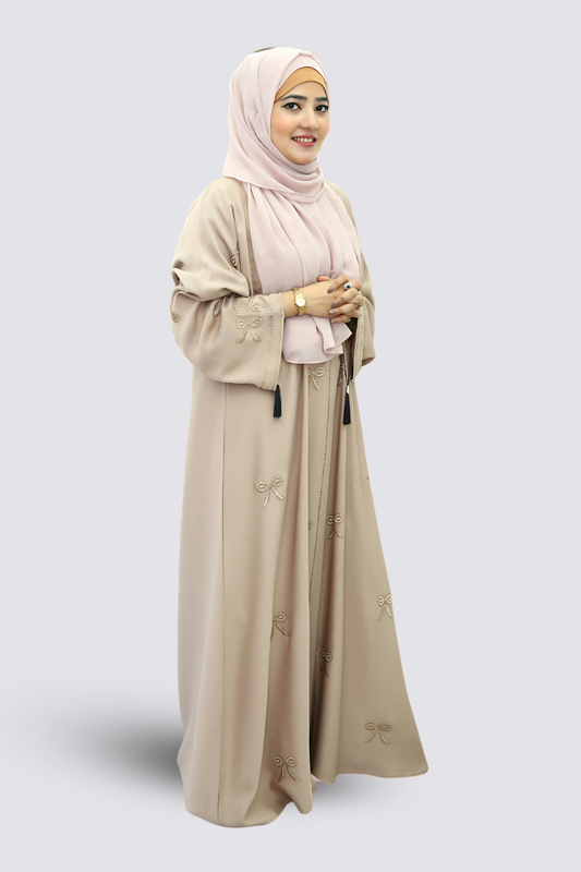 A girl standing in a studio wear premium quality abaya with contrast hijab