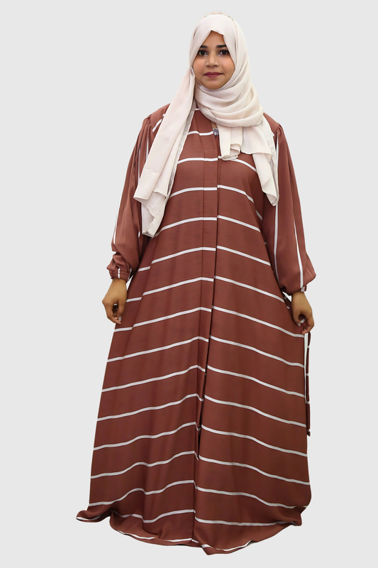 A girl standing in a studio wear premium quality abaya with contrast hijab