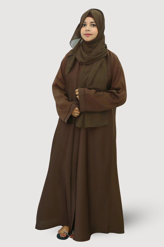 Woman wearing a brown abaya and hijab on a white background