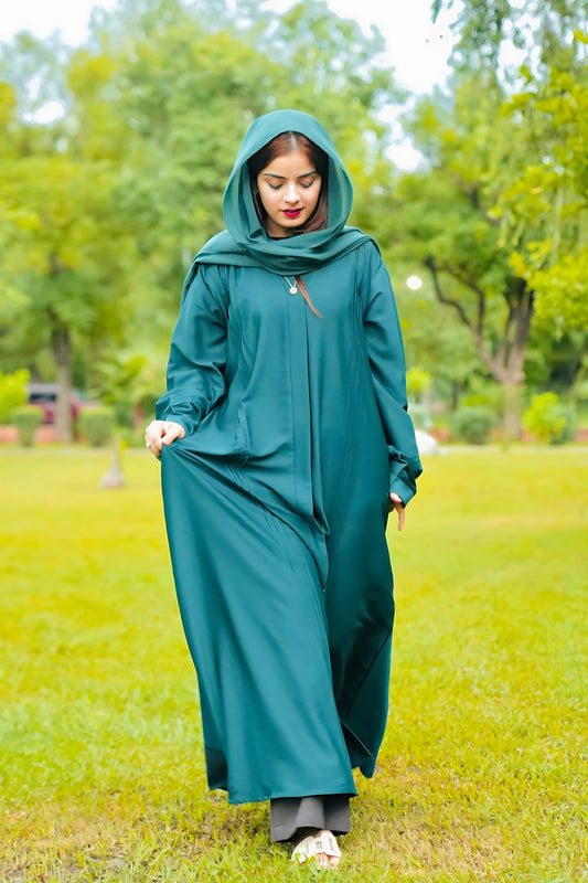 a girl wearing premium quality abaya in a park