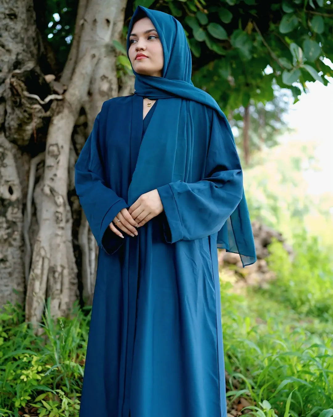 Girl is wearing premium quality abaya with matching hijab