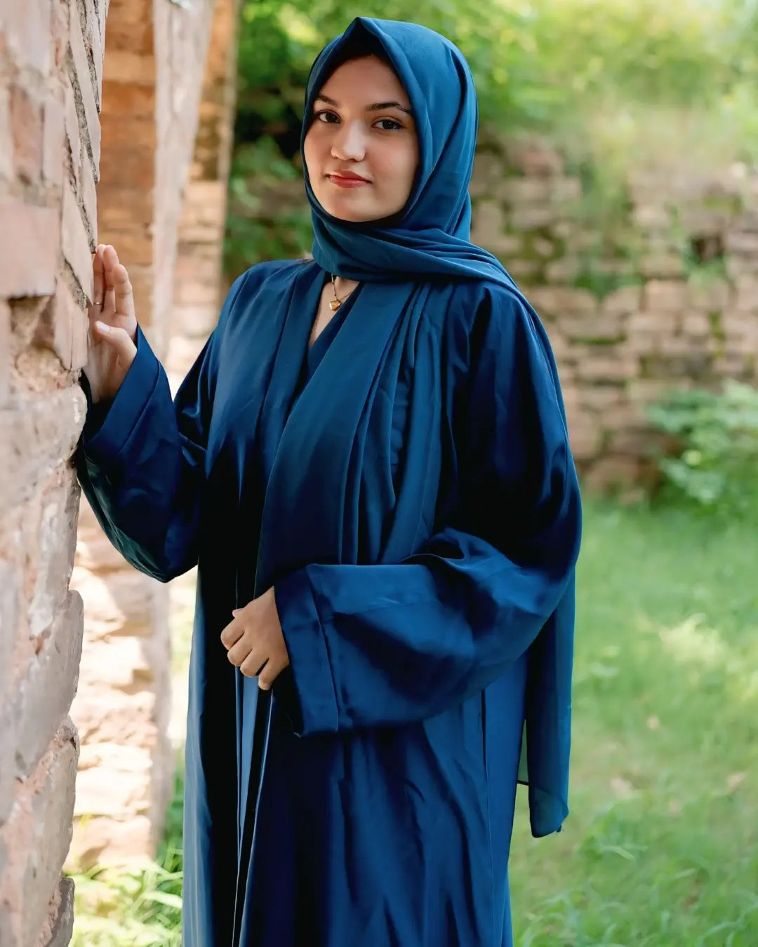 Girl is wearing premium quality abaya with matching hijab