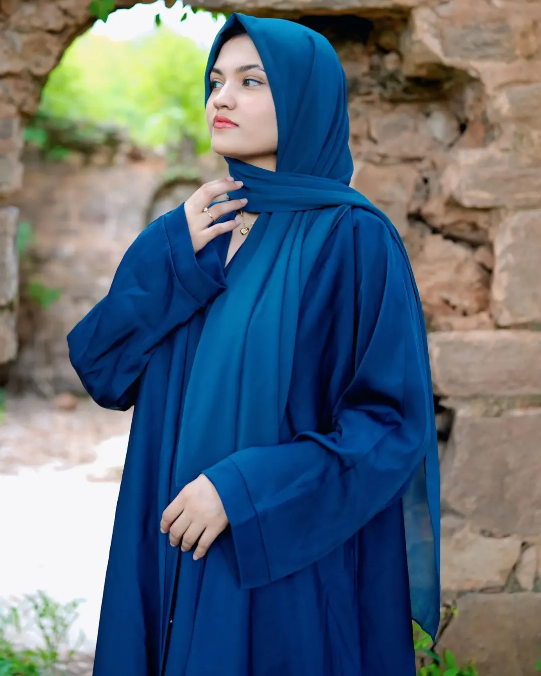 Girl is wearing premium quality abaya with matching hijab