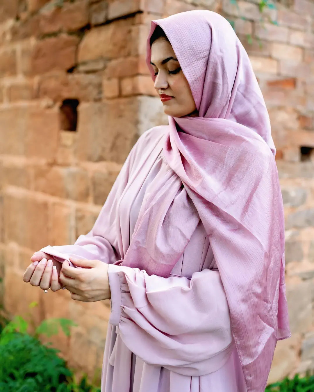 Girl is wearing premium quality abaya with matching hijab