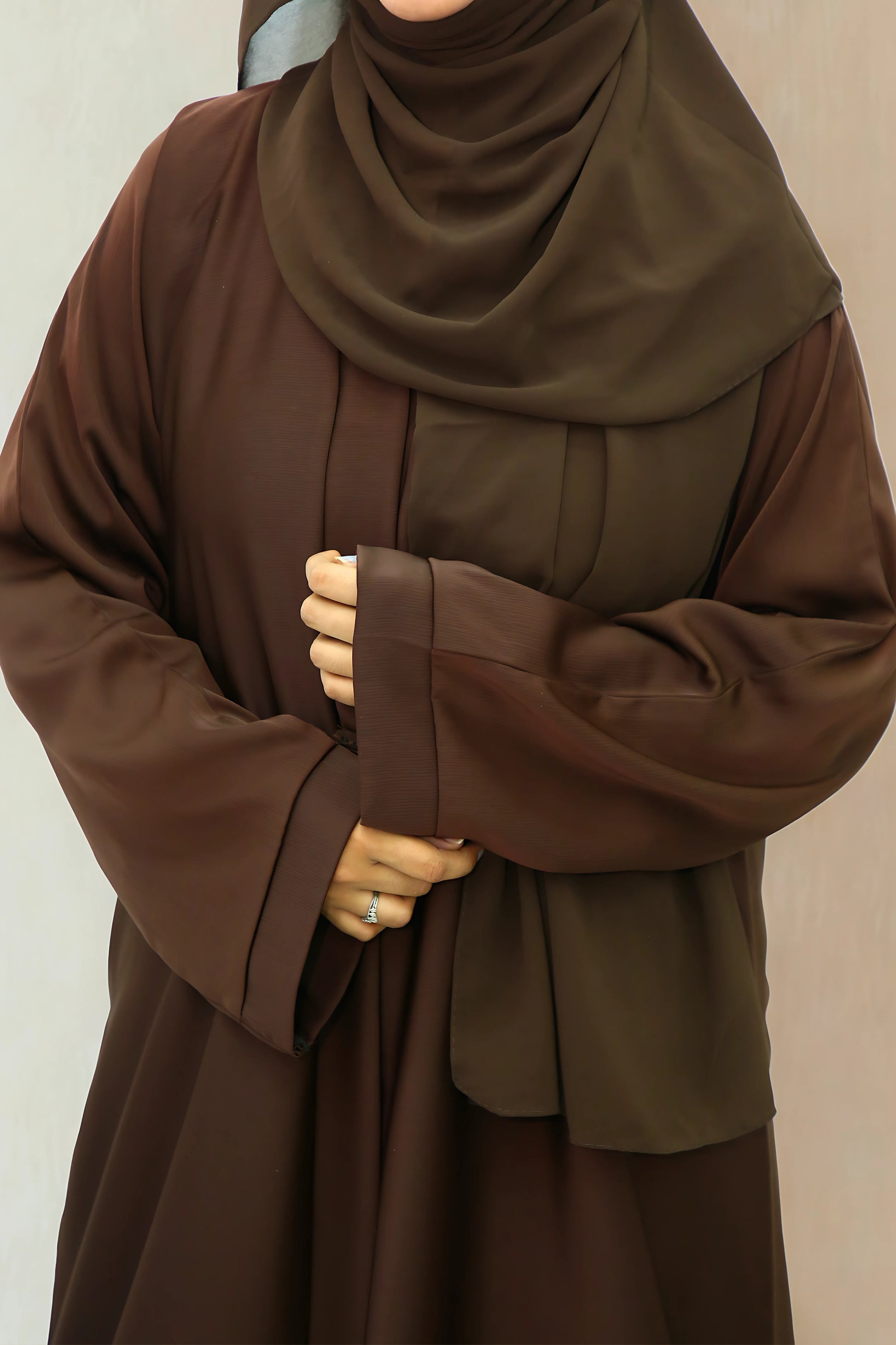 A Girl wearing an abaya and hijab