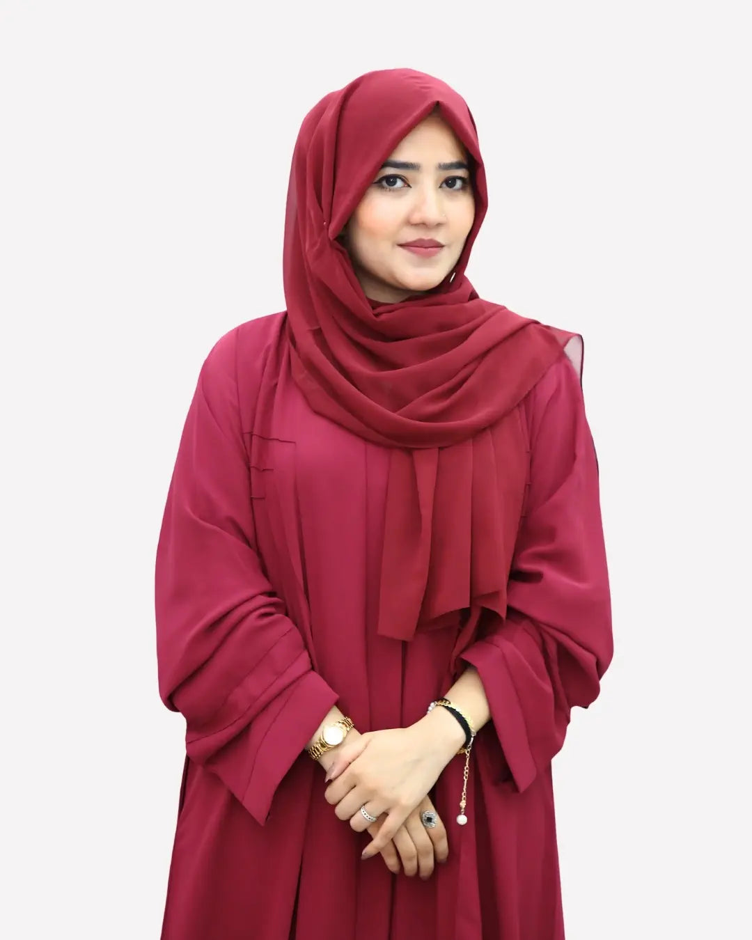 Red abaya worn by a model on a white background