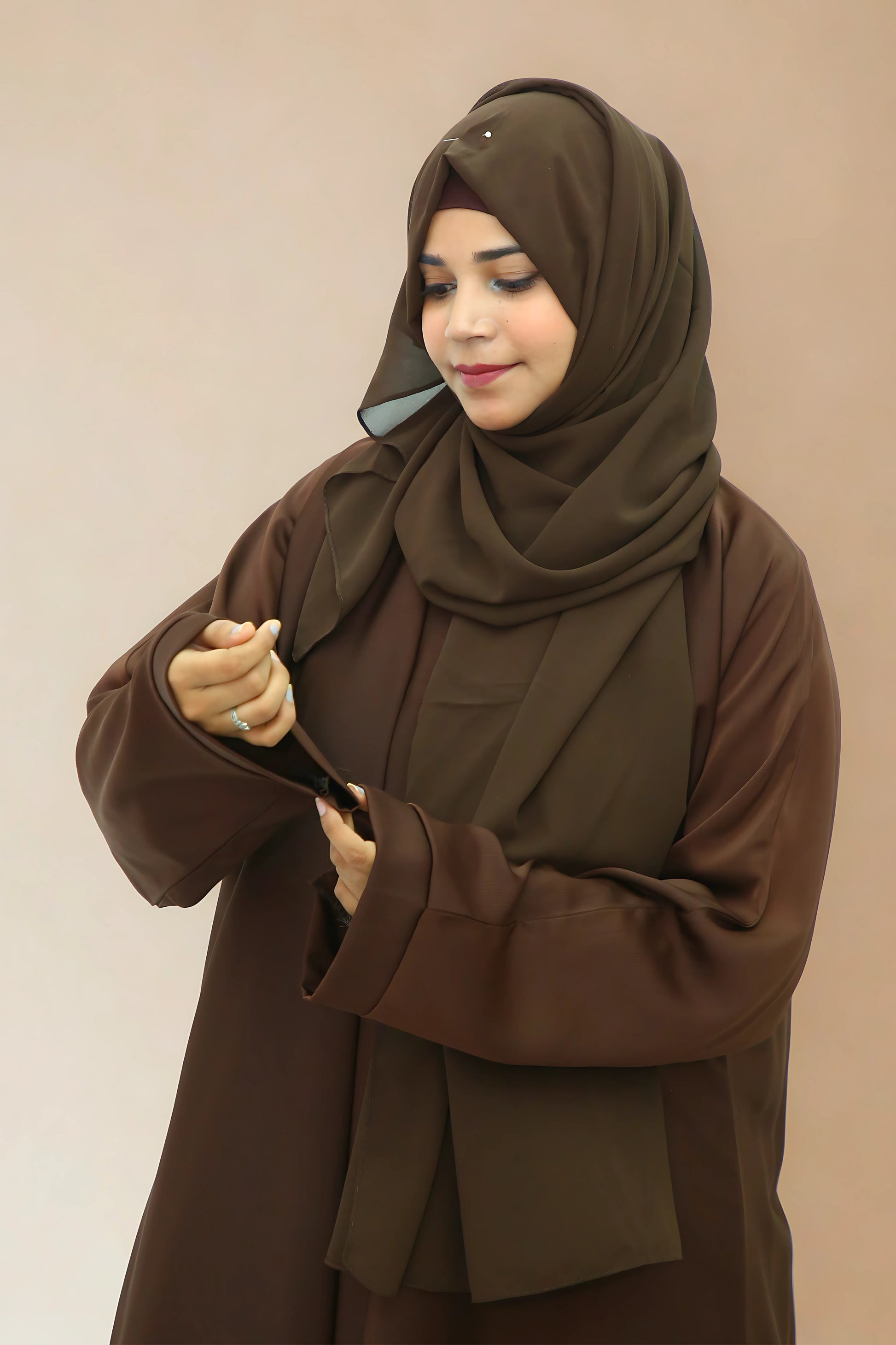 A Girl wearing an abaya and hijab
