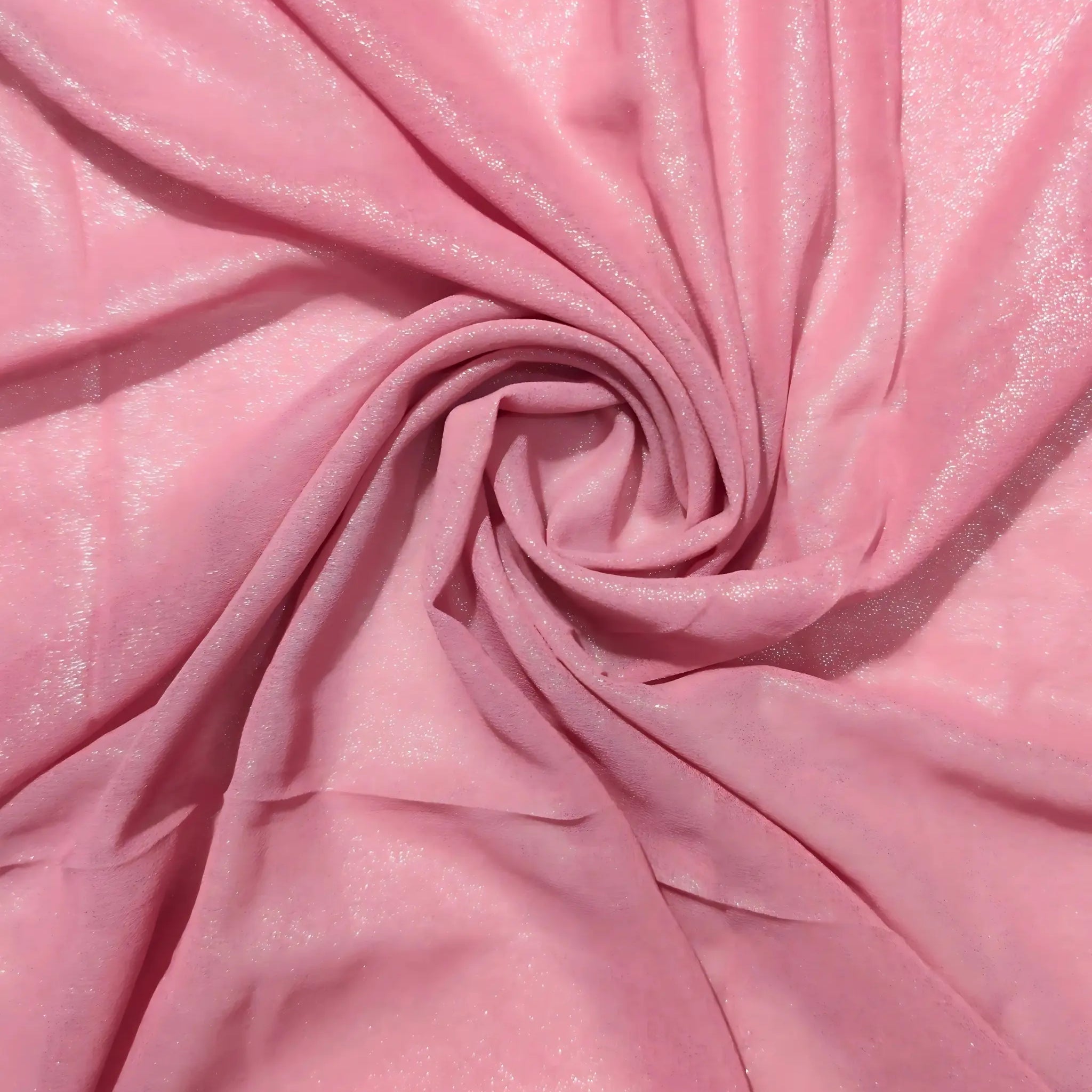 Close-up of pink fabric with a swirl pattern