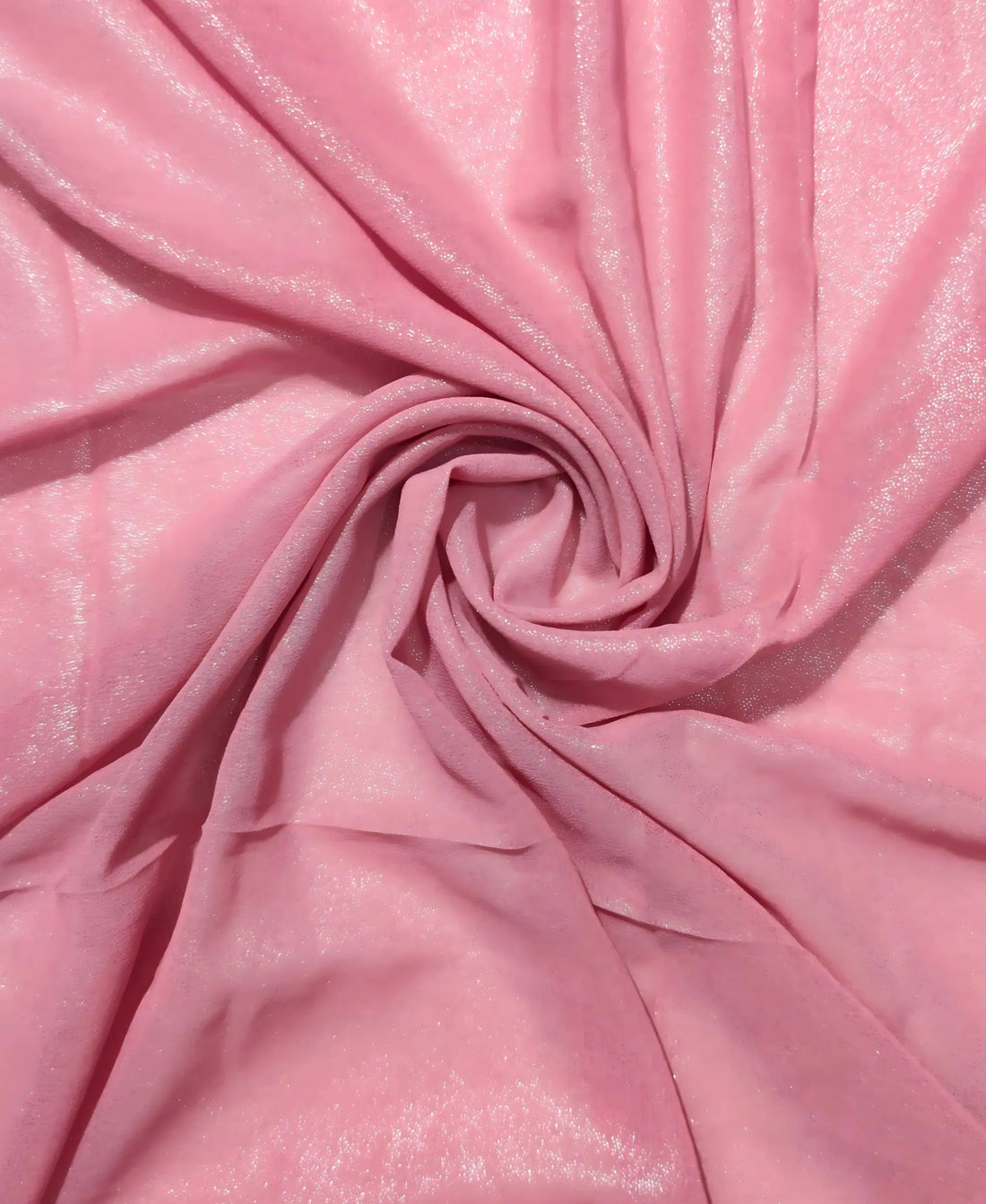 Close-up of pink fabric with a swirl pattern
