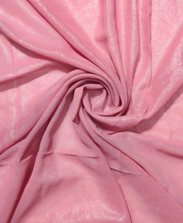 Close-up of pink fabric with a swirl pattern