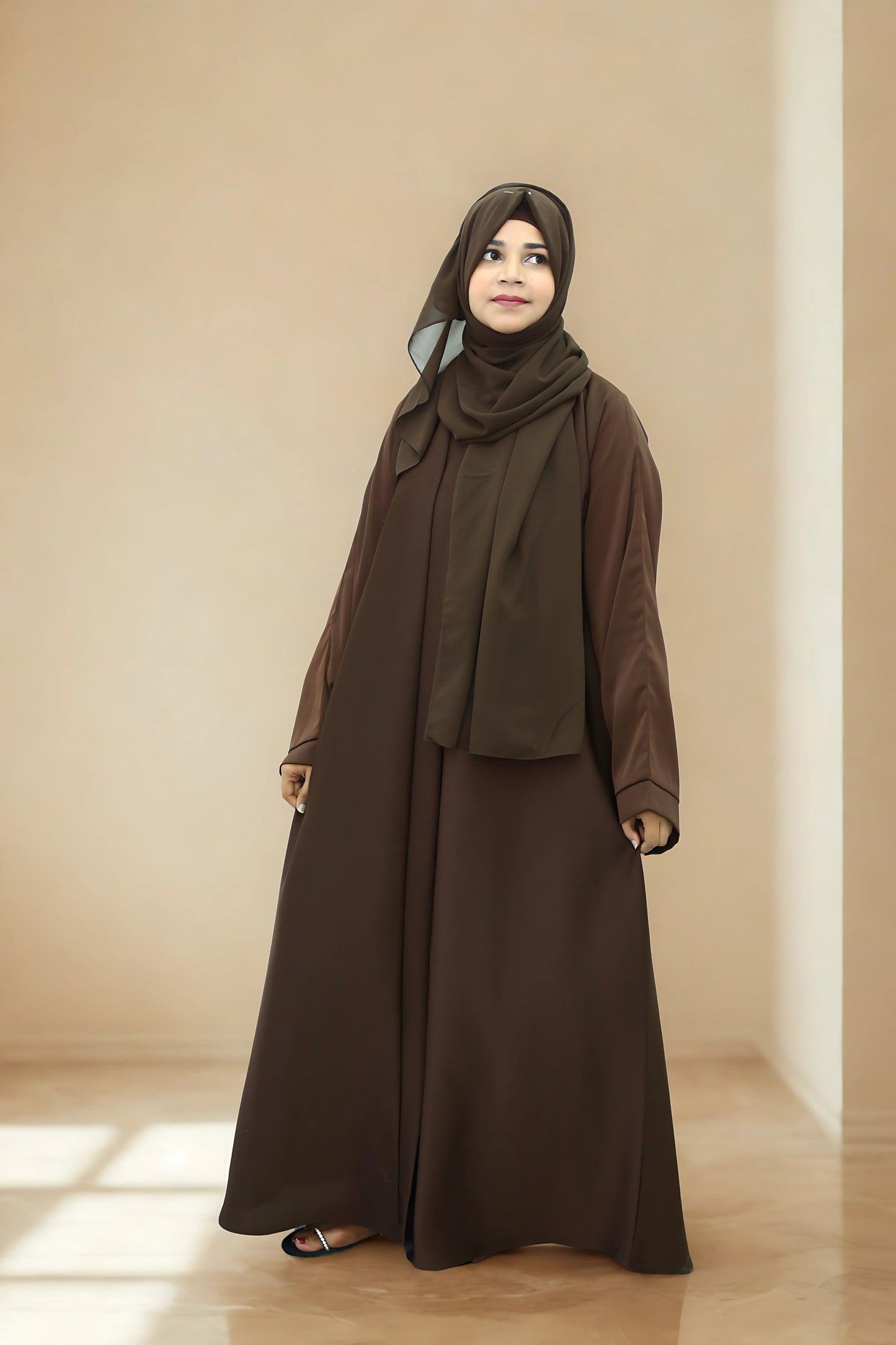 A Girl wearing an abaya and hijab