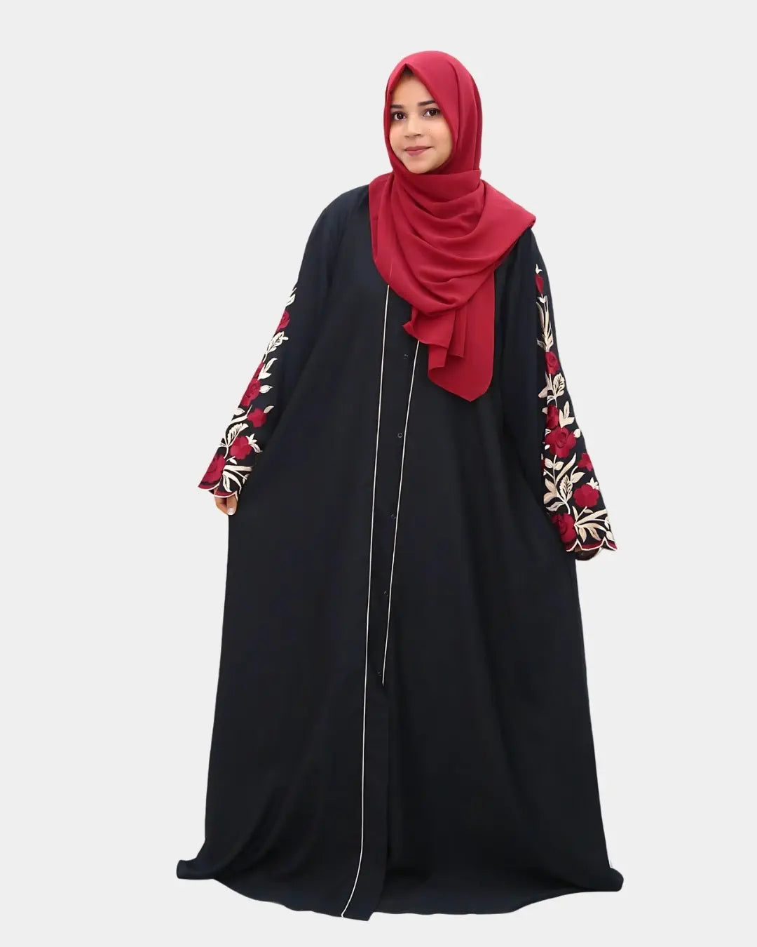 Black abaya with floral sleeves and a red hijab on a white background