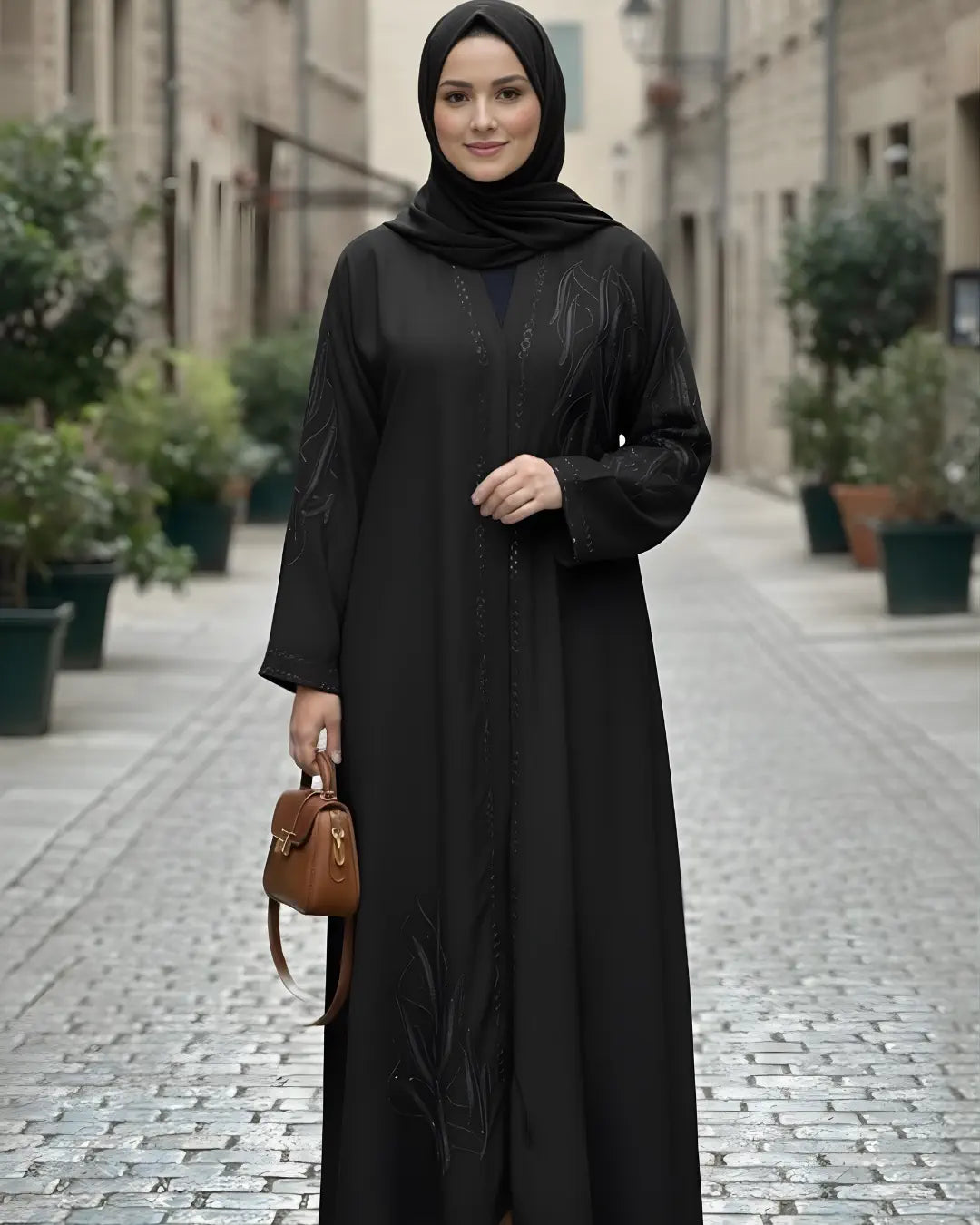Woman in a dark green abaya walking down a street with traditional architecture.