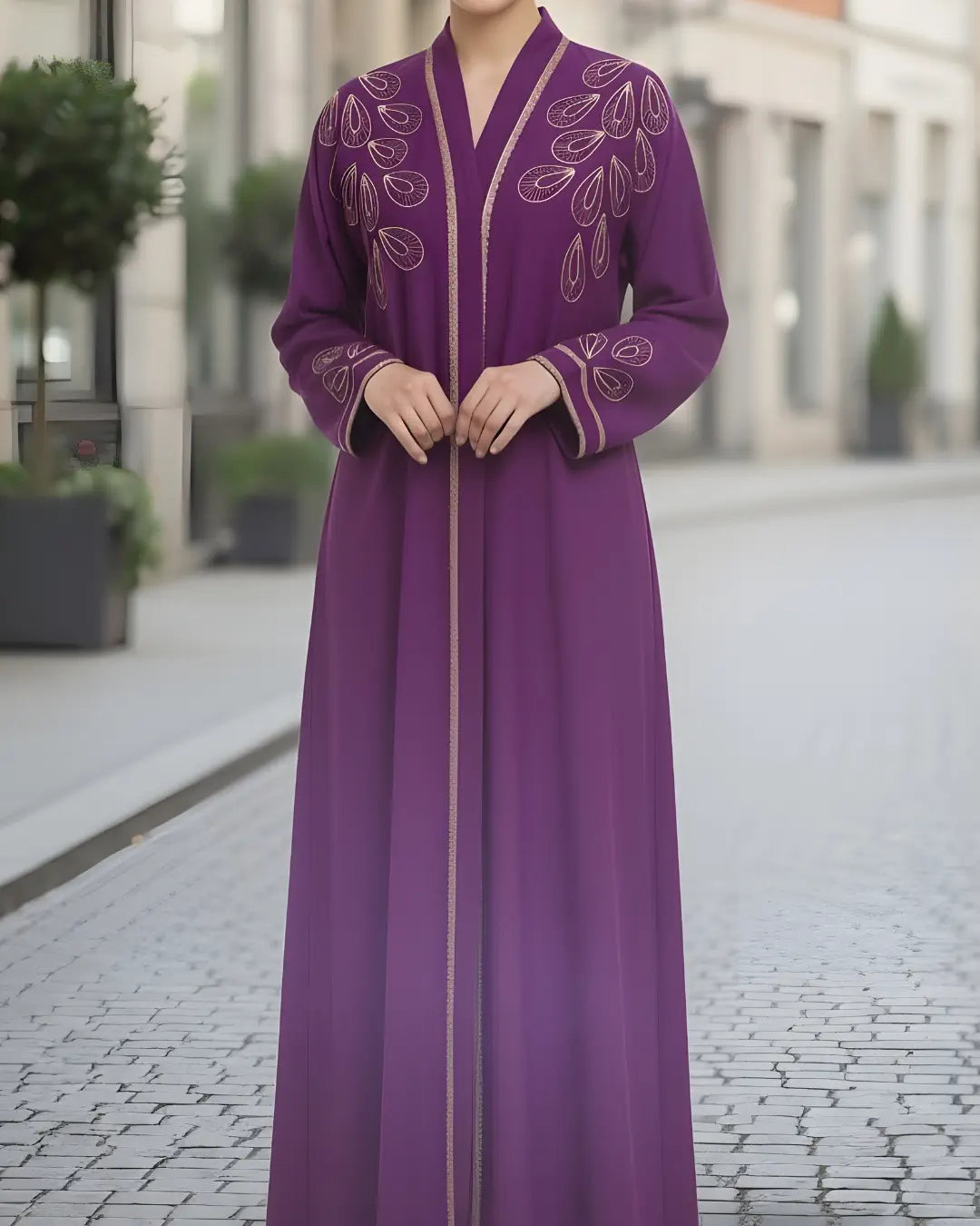 Person wearing a light green abaya on a city street.