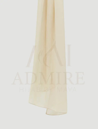 Beige scarf with 'Admire' text on a light gray background