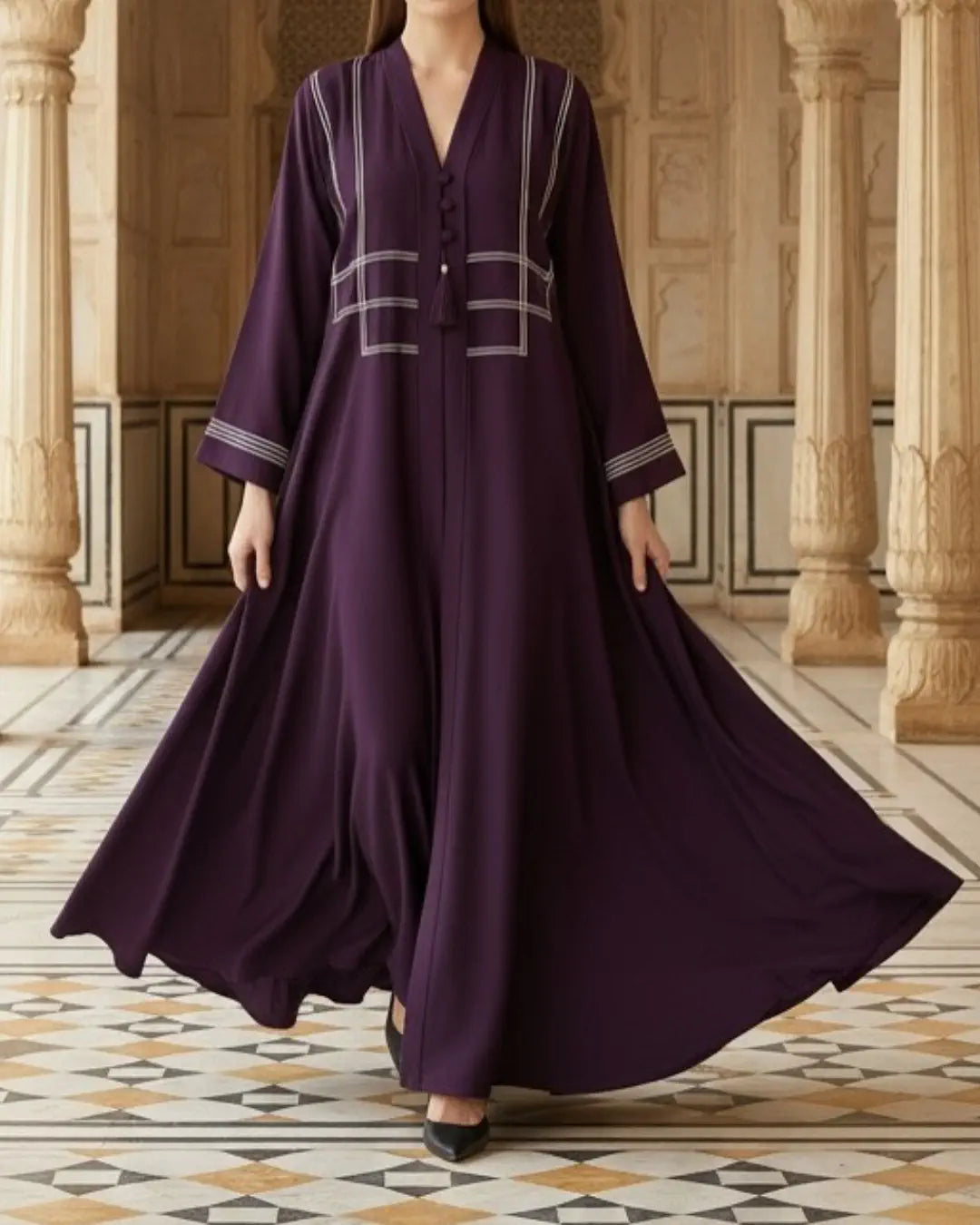 purple abaya with white embroidery in a decorative interior setting
