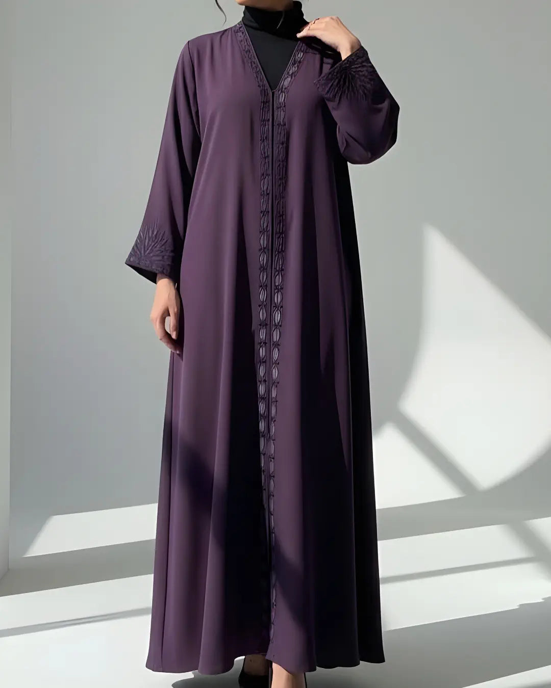 Purple ABAYA with a textured pattern on a white background