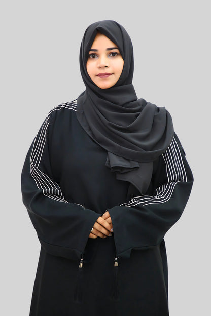 Chic modest outfit featuring a flowy abaya and soft fabric hijab for everyday wear.