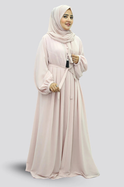 Elegant young woman wearing a black abaya and hijab, showcasing modest fashion style.
