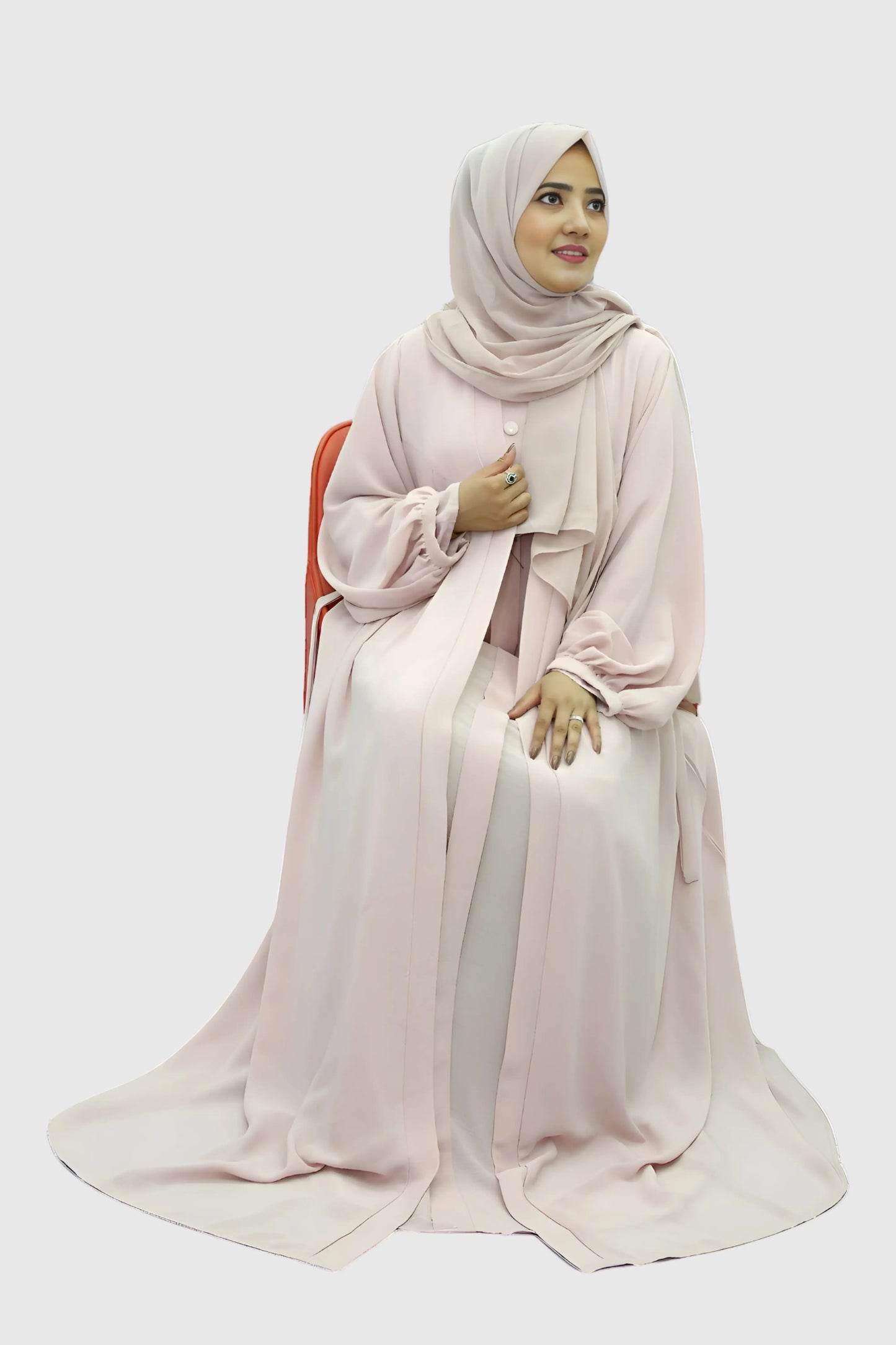 Elegant young woman wearing a black abaya and hijab, showcasing modest fashion style.