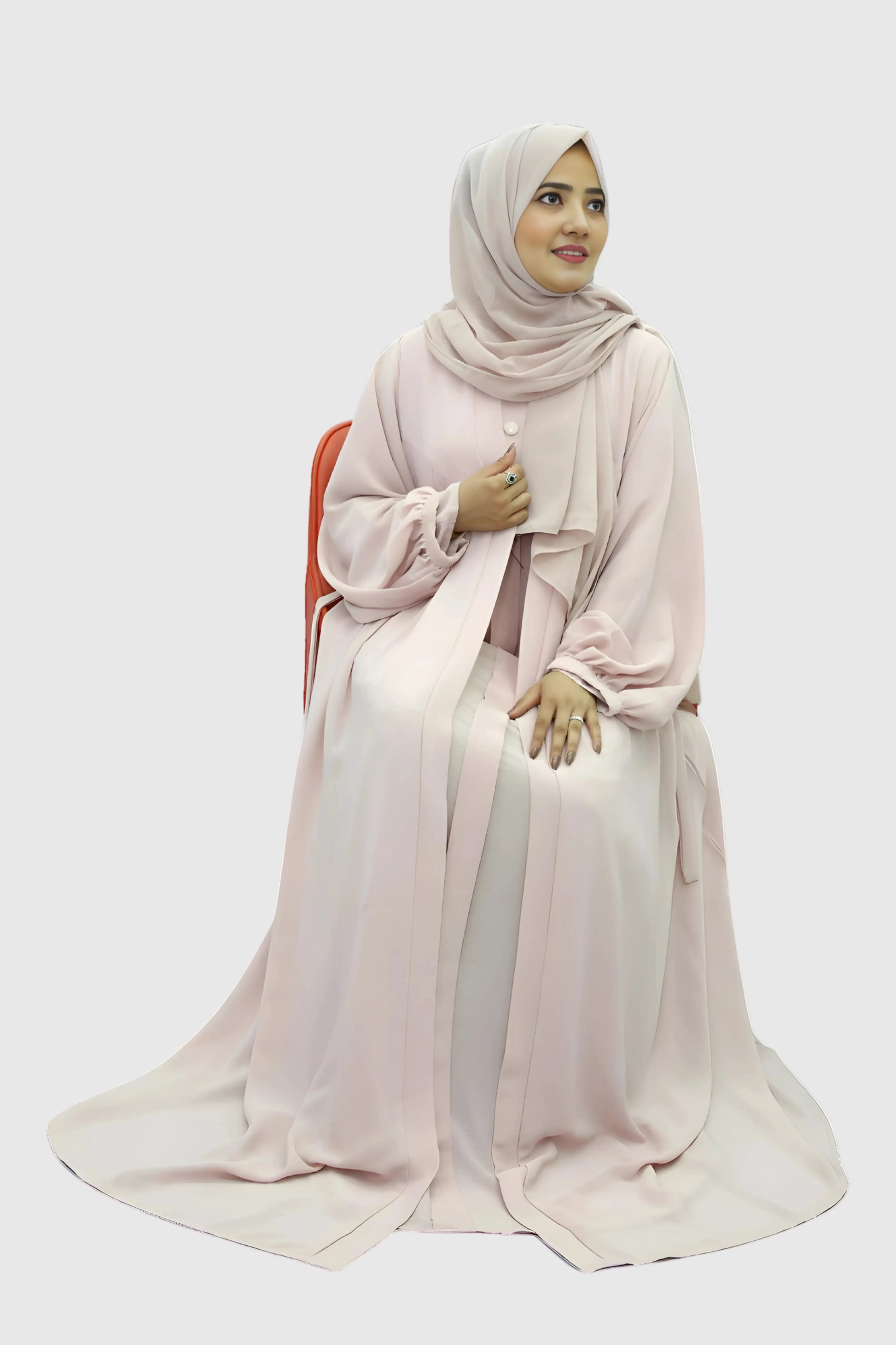 Elegant young woman wearing a black abaya and hijab, showcasing modest fashion style.